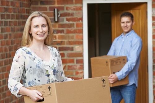 Professional packing services in Fortisgreen preparing boxes for a home move